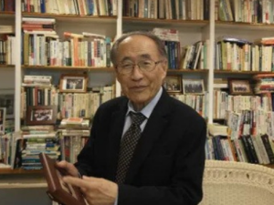 headshot of Young C. Kim in library